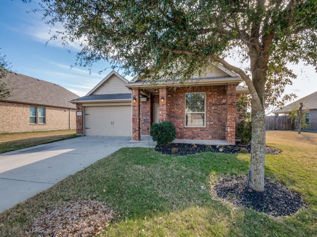 115 Garner Court Forney, TX 75126 - Photo 2 of 26 a front view of a house with a yard and garage