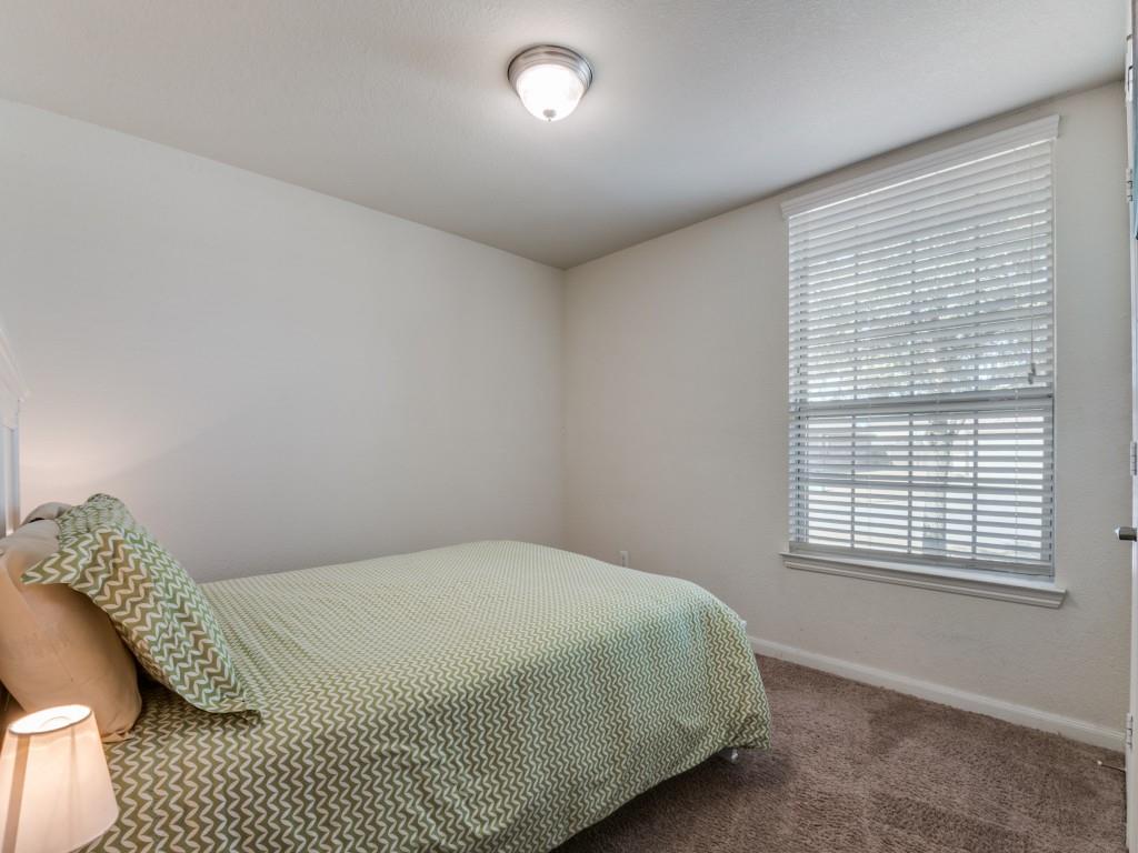 115 Garner Court Forney, TX 75126 - Photo 21 of 26 a bedroom with a bed and a window