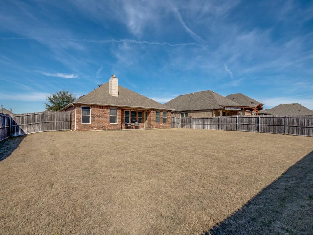 115 Garner Court Forney, TX 75126 - Photo 24 of 26 a front view of a house with a yard