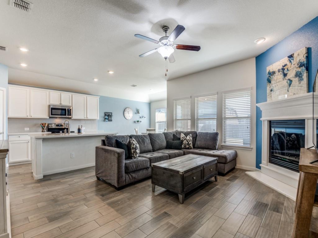 115 Garner Court Forney, TX 75126 - Photo 5 of 26 a living room with furniture and fireplace