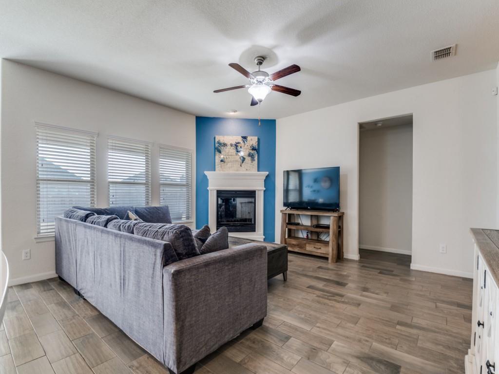 115 Garner Court Forney, TX 75126 - Photo 6 of 26 a living room with furniture and a fireplace