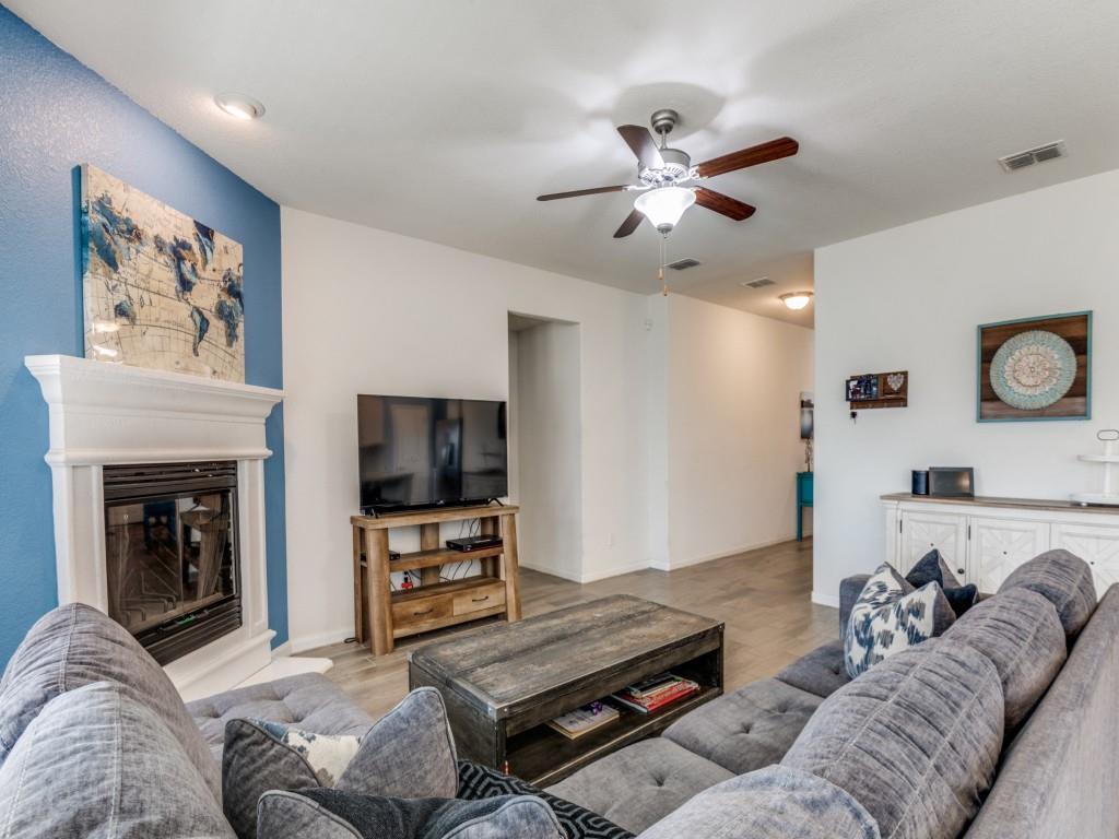 115 Garner Court Forney, TX 75126 - Photo 7 of 26 a living room with furniture and a flat screen tv