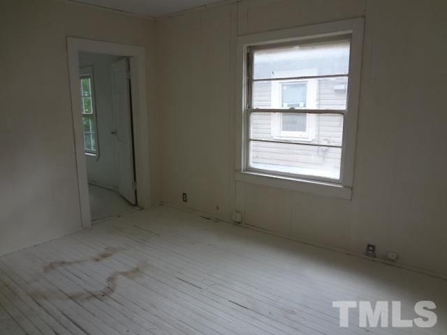 1508 Poole Road Raleigh, NC 27610 - Photo 3 of 8 a view of an empty room with a window
