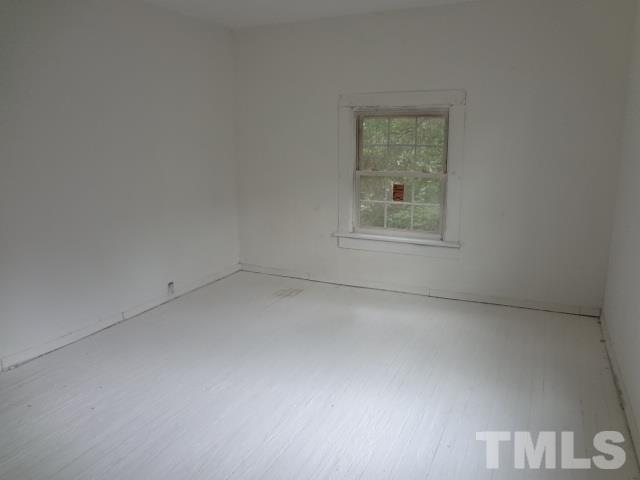 1508 Poole Road Raleigh, NC 27610 - Photo 4 of 8 an empty room with a window