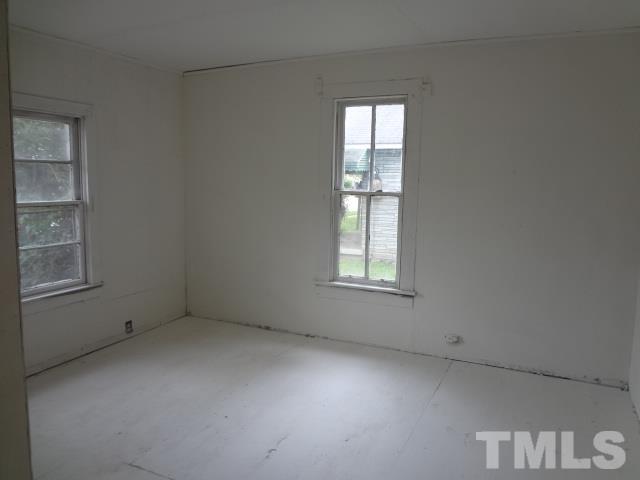 1508 Poole Road Raleigh, NC 27610 - Photo 5 of 8 an empty room with windows