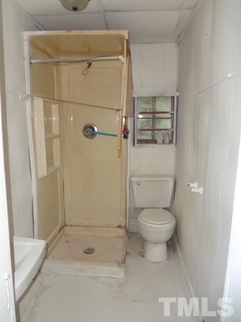 1508 Poole Road Raleigh, NC 27610 - Photo 7 of 8 a bathroom with a toilet and a shower