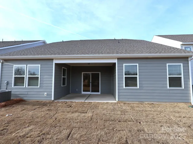 a large kitchen with stainless steel appliances and a refrigerator