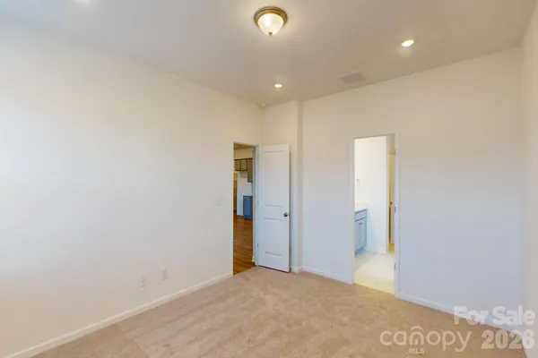 a view of a livingroom with a ceiling fan and window