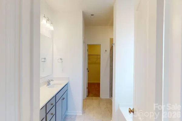a bathroom with a tub and shower