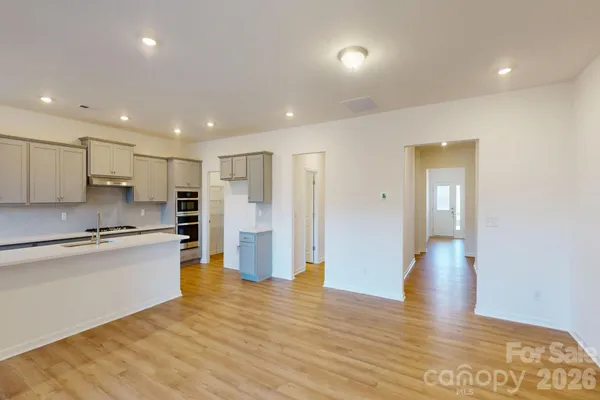 a view of kitchen with wooden floor