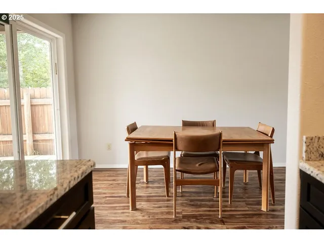 a kitchen with wooden cabinets and a stainless steel appliances