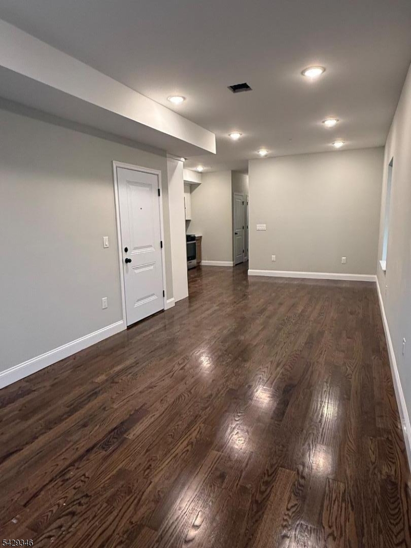 223 South 11th Street Newark, NJ 07107 - Photo 3 of 11 a view of an empty room with wooden floor