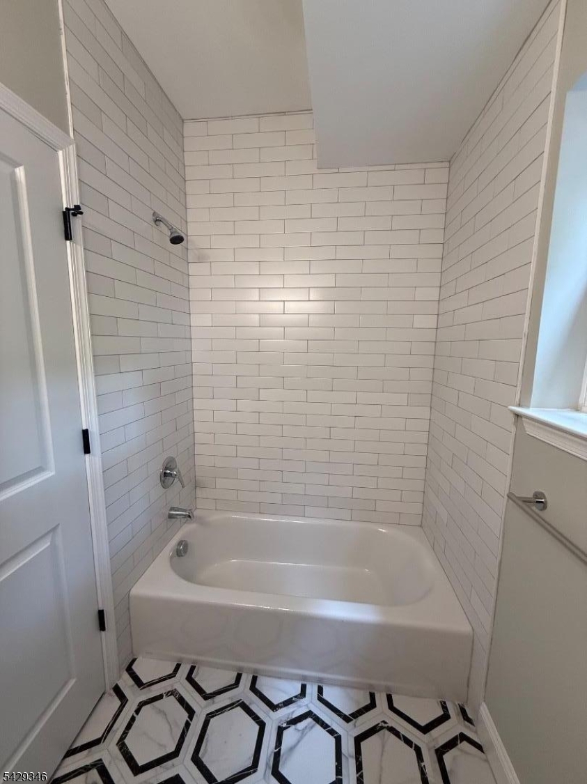 223 South 11th Street Newark, NJ 07107 - Photo 8 of 11 a bathroom with a bathtub and shower