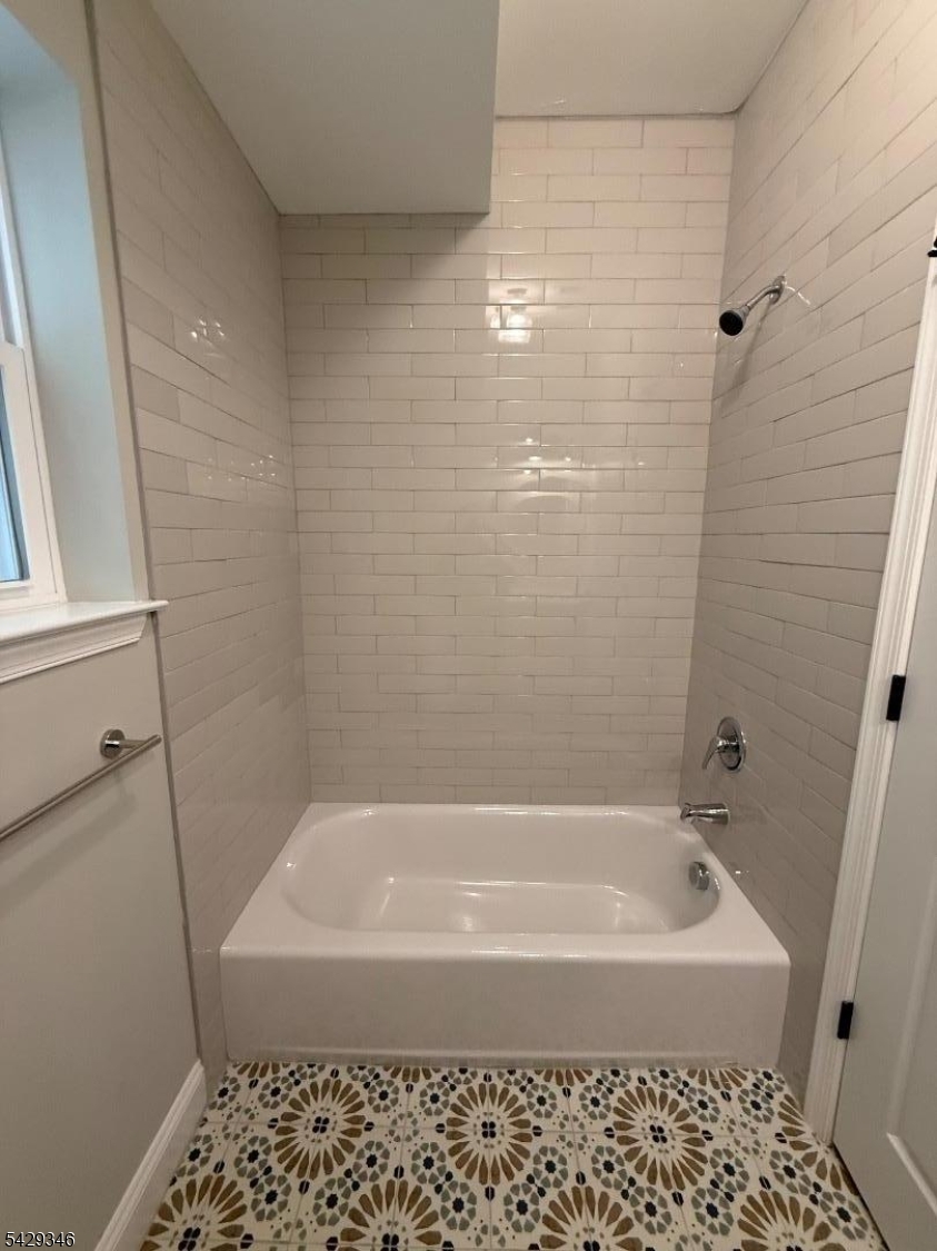 223 South 11th Street Newark, NJ 07107 - Photo 10 of 11 a bathroom with bathtub and shower