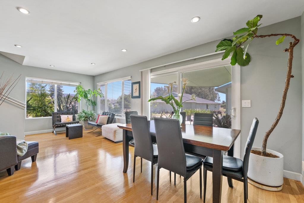 261 Wheelock Road Watsonville, CA 95076 - Photo 11 of 44 a dining room with furniture potted plants and wooden floor