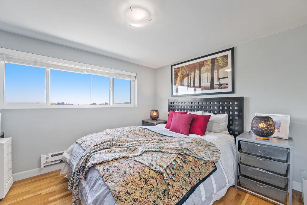 261 Wheelock Road Watsonville, CA 95076 - Photo 16 of 44 a bedroom with a bed and cabinets