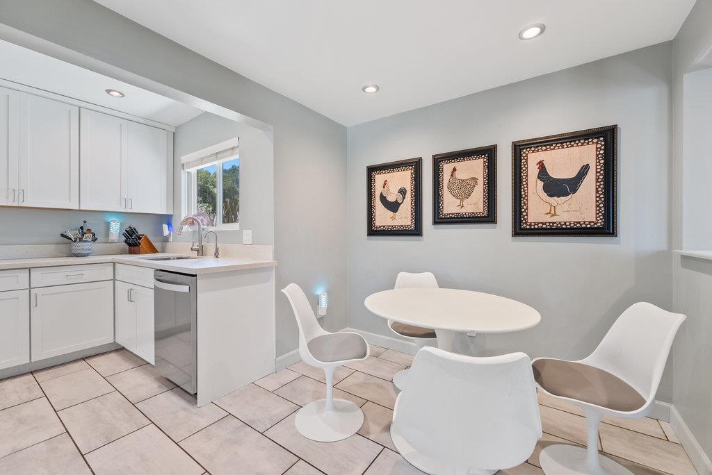 261 Wheelock Road Watsonville, CA 95076 - Photo 19 of 44 a kitchen with a white cabinets and chairs
