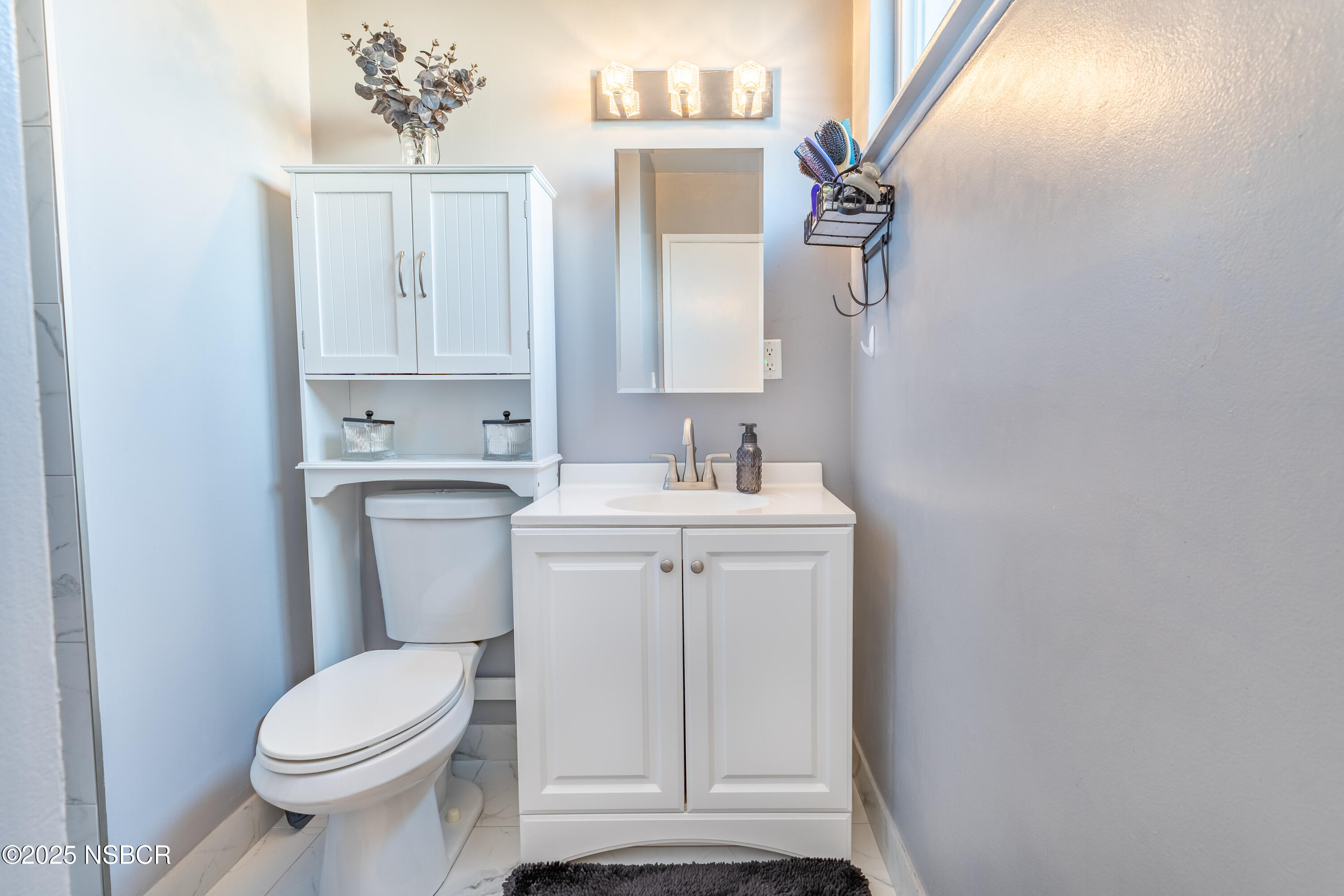 3478 Via Cortez Lompoc, CA 93436 - Photo 11 of 19 a white toilet sitting next to a bathroom sink