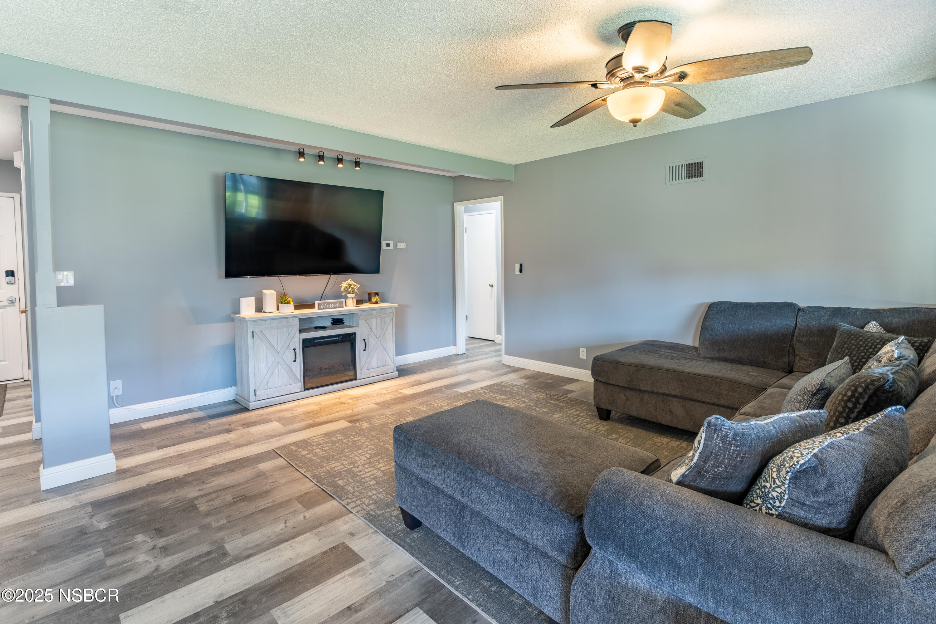 3478 Via Cortez Lompoc, CA 93436 - Photo 9 of 19 a living room with furniture and a flat screen tv