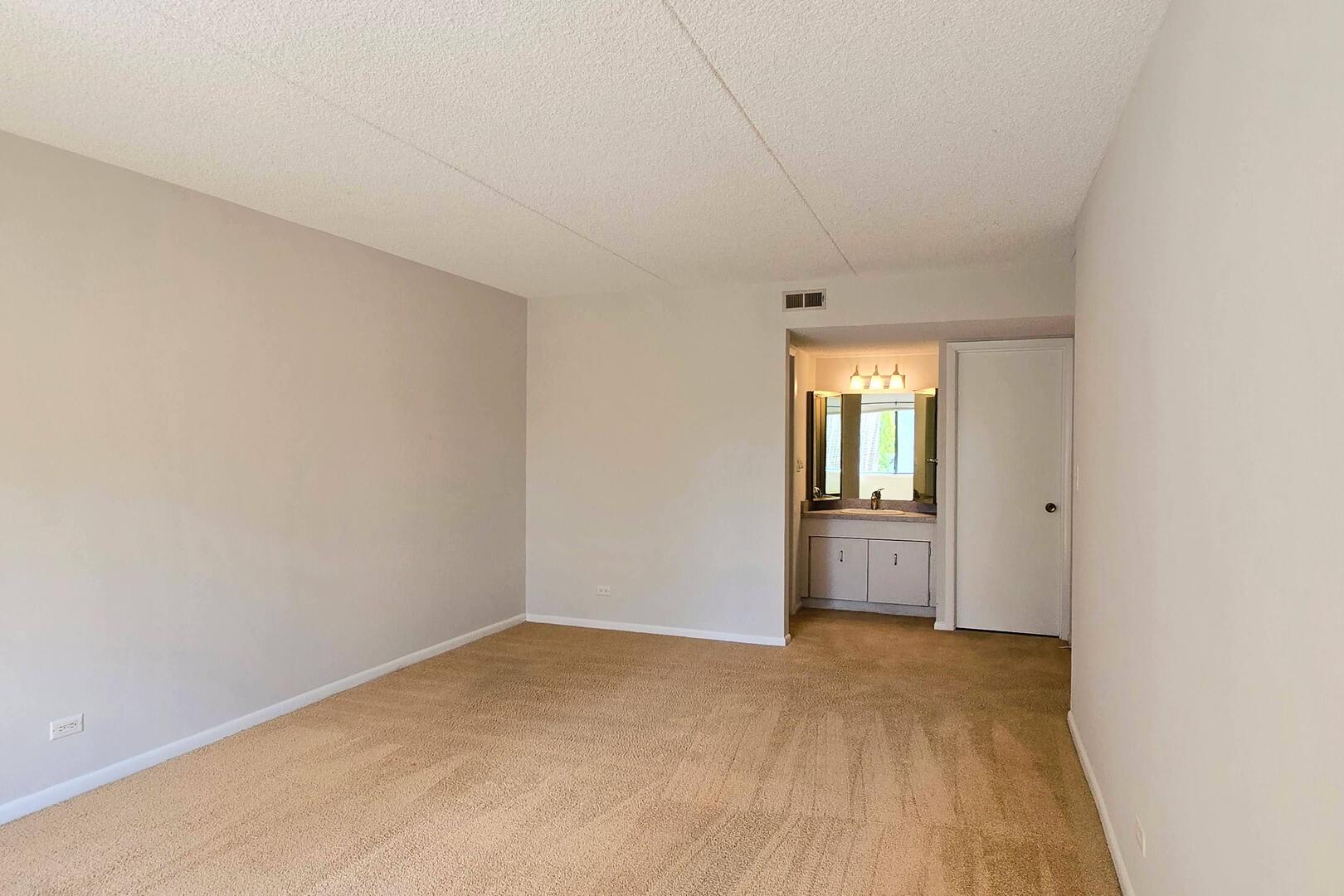 690 Chandler Road, Unit 207 Gurnee, IL 60031 - Photo 11 of 17 a view of an empty room and window