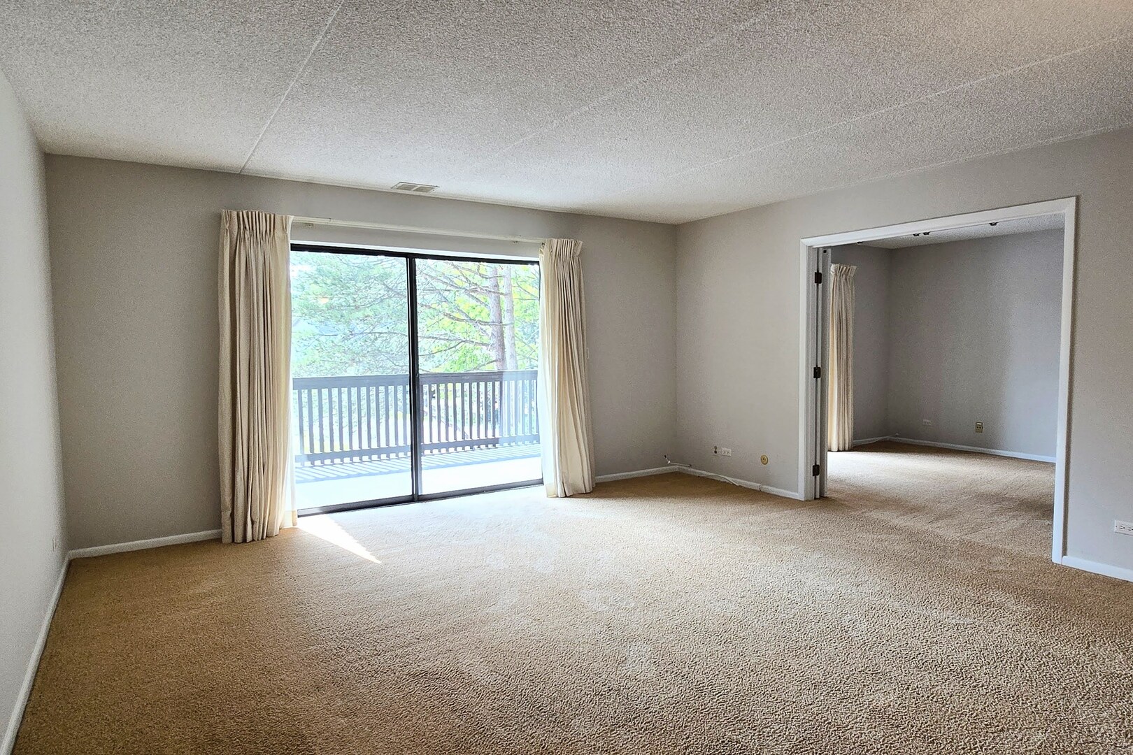 690 Chandler Road, Unit 207 Gurnee, IL 60031 - Photo 3 of 17 an empty room with windows and closet
