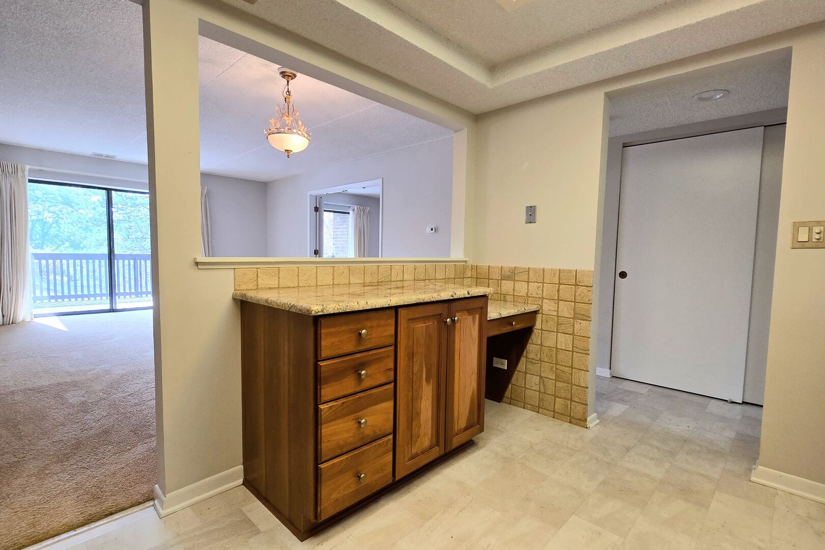 690 Chandler Road, Unit 207 Gurnee, IL 60031 - Photo 7 of 17 a bathroom with a granite countertop sink and a mirror