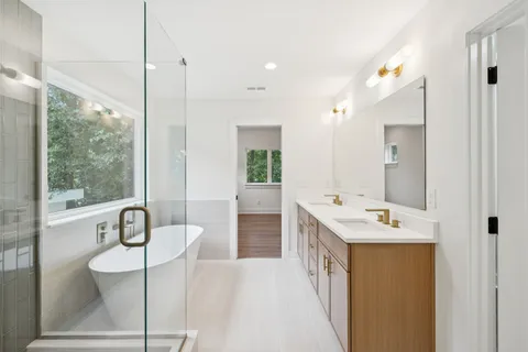 a bathroom with a bathtub and shower