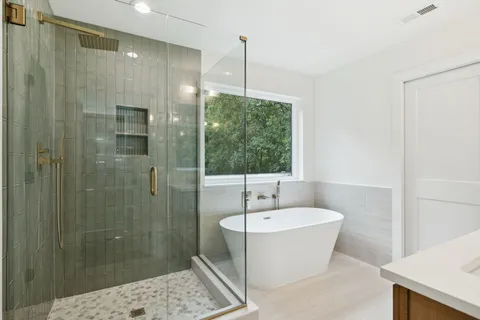 a white bath tub sitting in a bathroom
