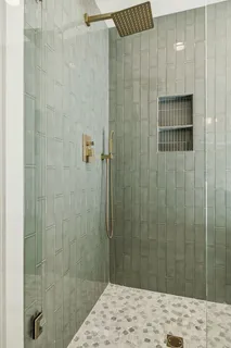 a bathroom with a sink vanity and a mirror