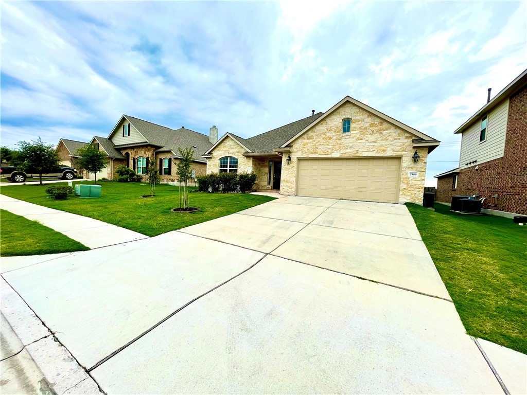 a front view of a house with yard
