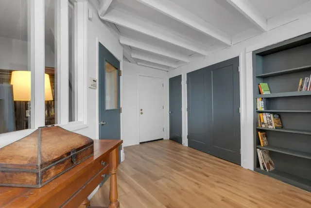 a bedroom with a bed and a cabinets