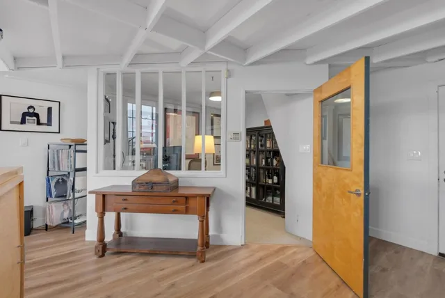 a bedroom with furniture and a window