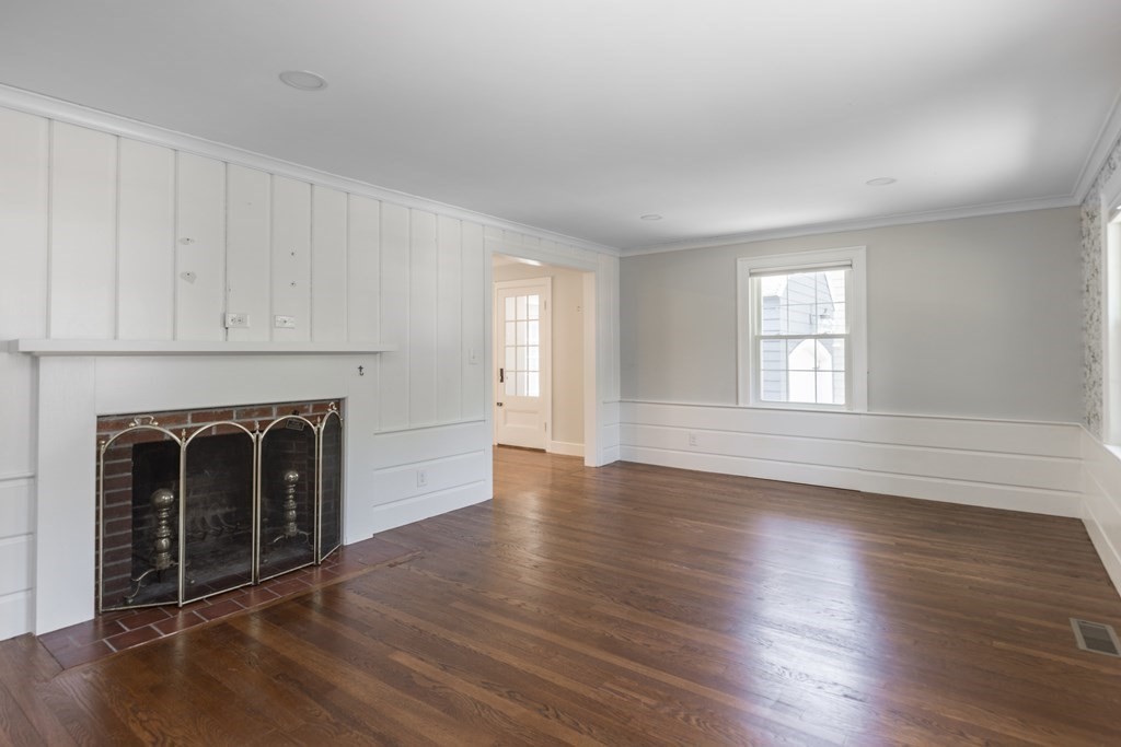 11 Eaton Road Lexington, MA 02420 - Photo 3 of 15 a view of an empty room with wooden floor and a window