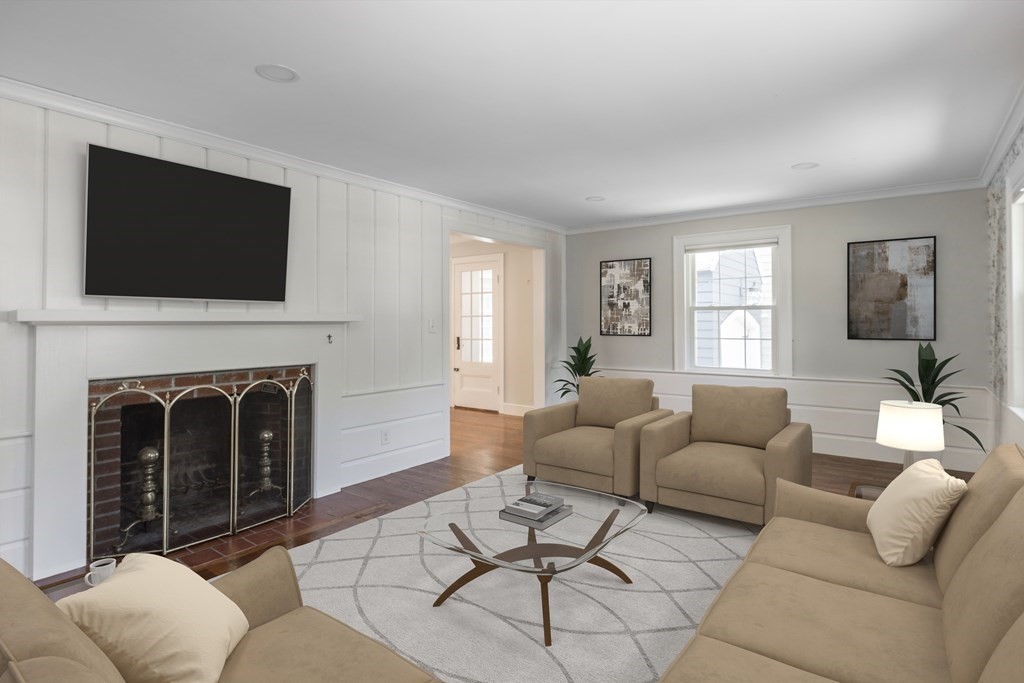 11 Eaton Road Lexington, MA 02420 - Photo 4 of 15 a living room with furniture a fireplace and a flat screen tv
