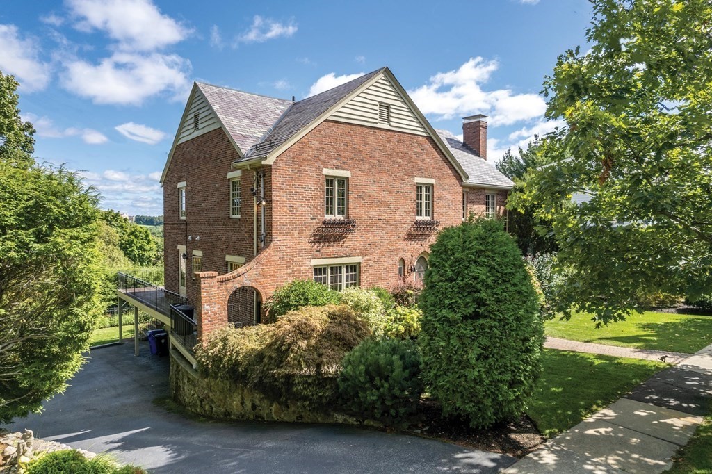 35 Shaw Road Brookline, MA 02467 - Photo 2 of 40 a front view of a house with garden