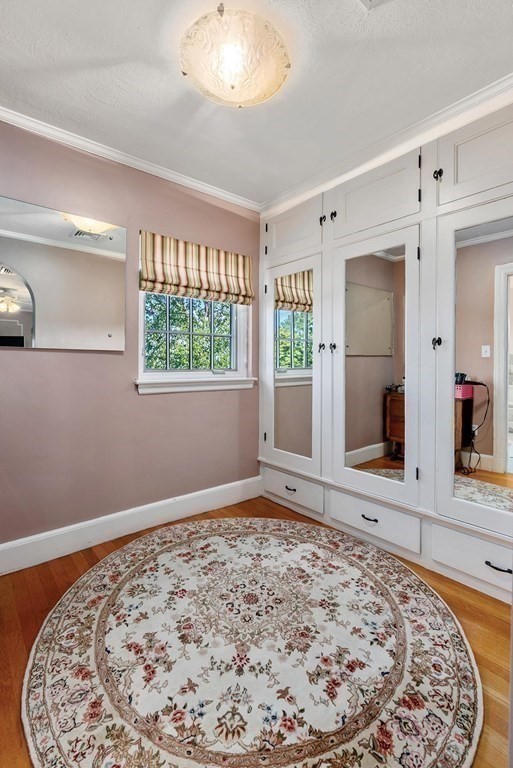 35 Shaw Road Brookline, MA 02467 - Photo 22 of 40 wooden floor in an empty room with a window