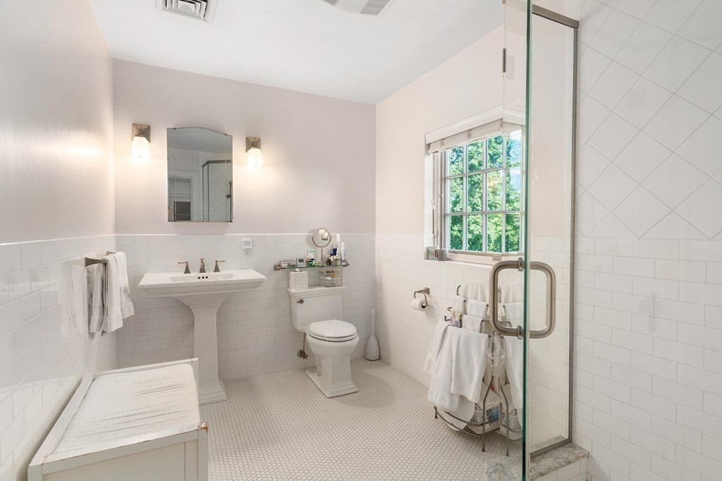 35 Shaw Road Brookline, MA 02467 - Photo 23 of 40 a bathroom with a sink toilet and shower