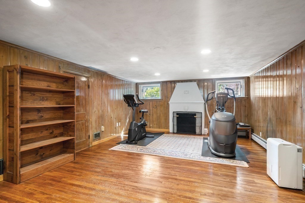 35 Shaw Road Brookline, MA 02467 - Photo 29 of 40 a view of a livingroom with a fireplace and window