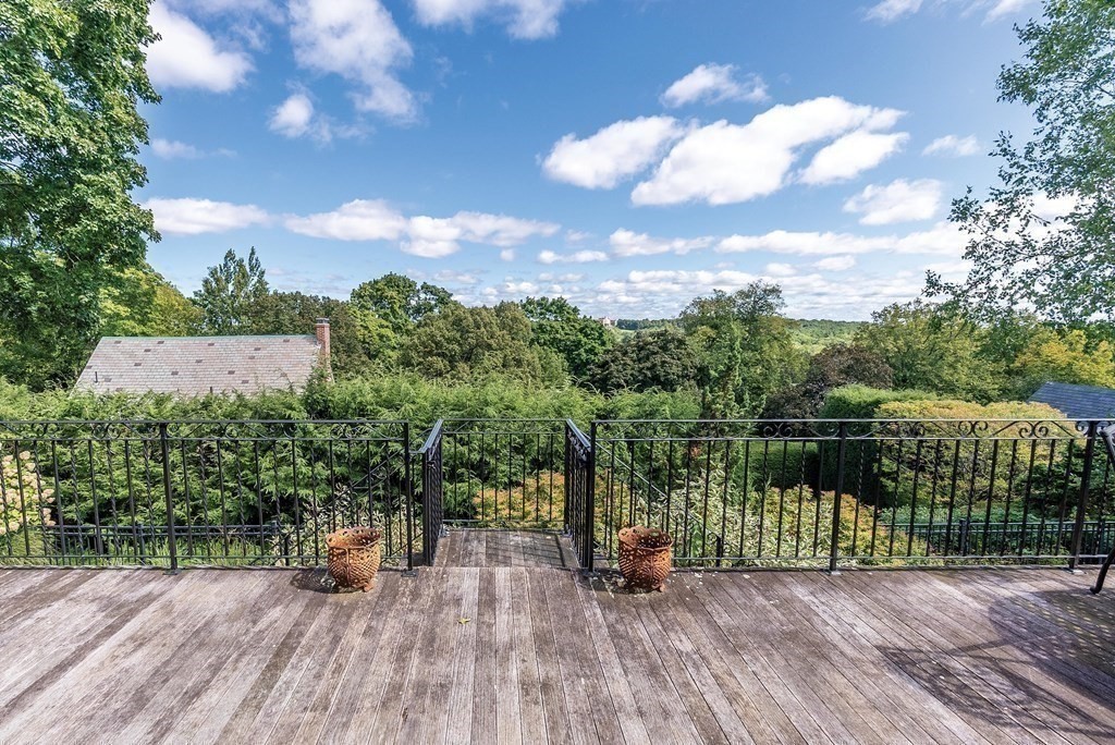 35 Shaw Road Brookline, MA 02467 - Photo 32 of 40 a view of a lake with a floor to ceiling window next to a yard