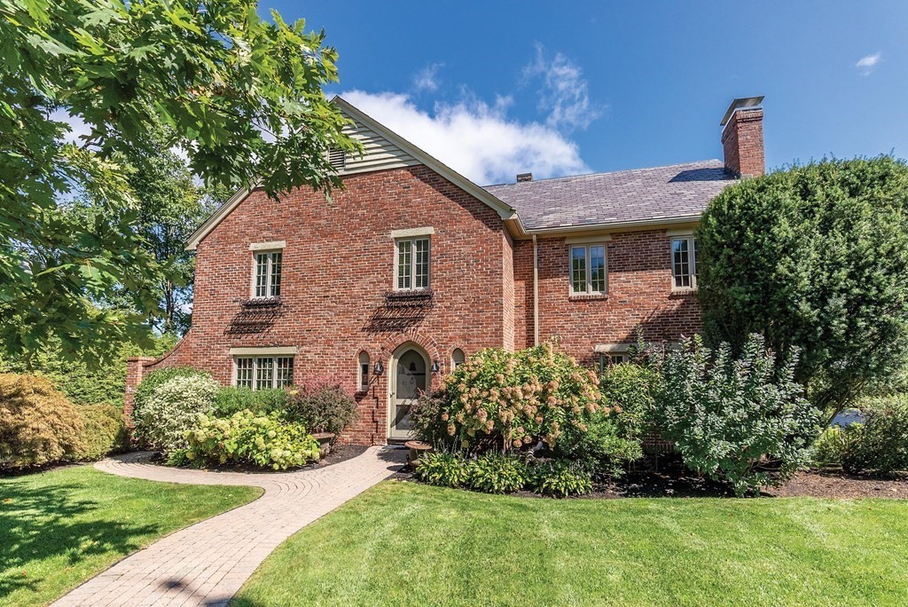 35 Shaw Road Brookline, MA 02467 - Photo 4 of 40 a front view of a house with a yard