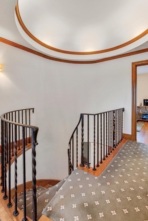 35 Shaw Road Brookline, MA 02467 - Photo 7 of 40 a view of a hallway with wooden floor and staircase