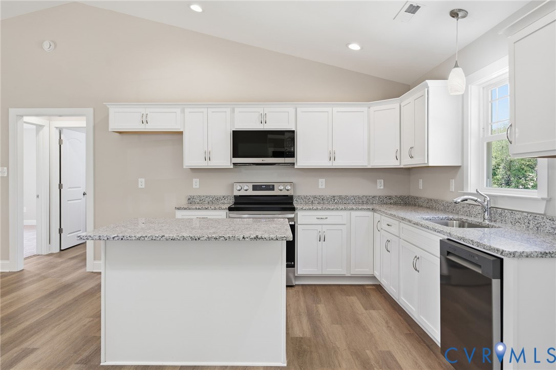 17557 Hewlett Road Beaverdam, VA 23015 - Photo 11 of 29 a kitchen with stainless steel appliances granite countertop a stove a sink and a granite counter tops