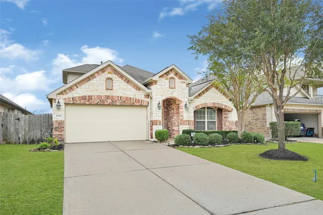 a front view of a house with yard