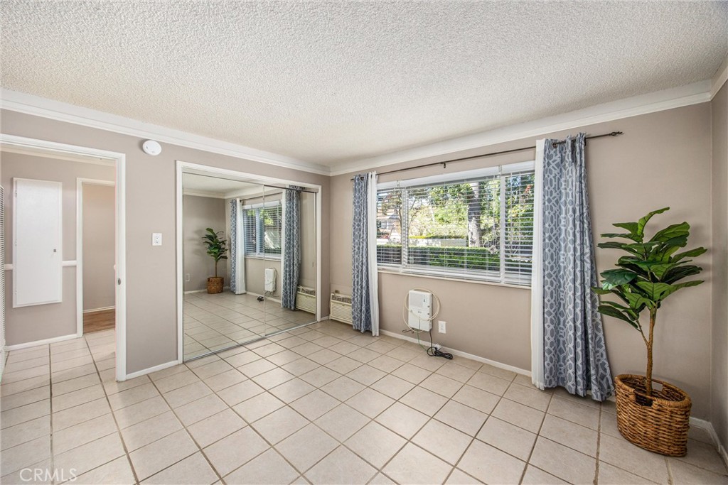 135 North Center Street Redlands, CA 92373 - Photo 19 of 36 a view of an entryway with a potted plant in front of a house