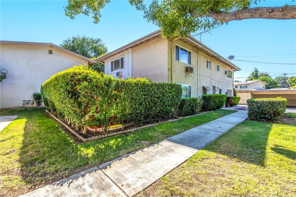 135 North Center Street Redlands, CA 92373 - Photo 29 of 36 a front view of a house with garden