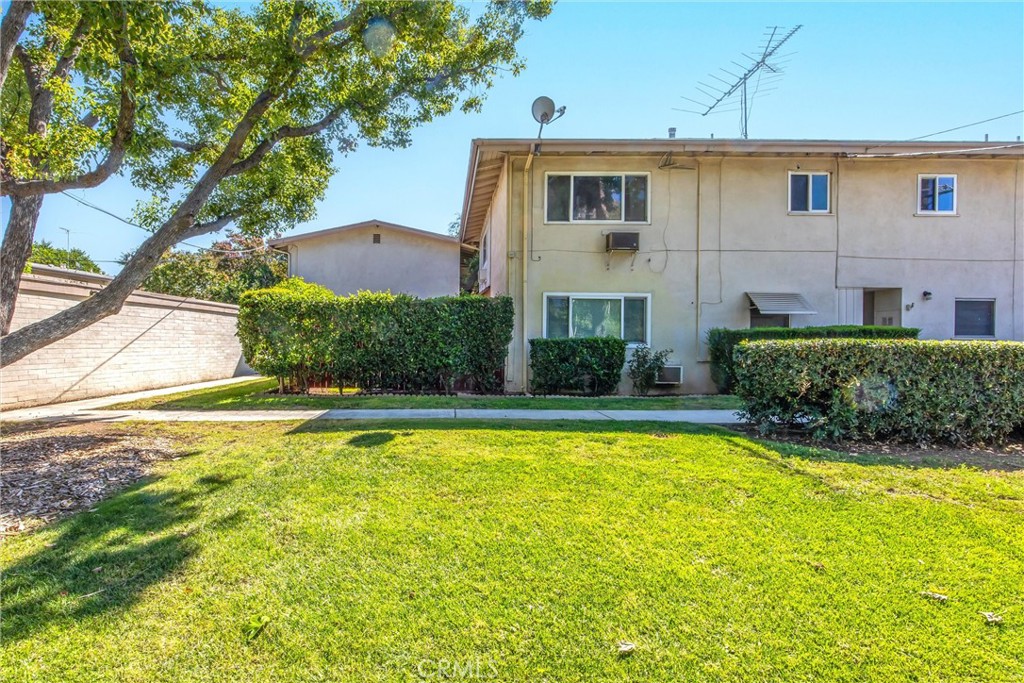 135 North Center Street Redlands, CA 92373 - Photo 30 of 36 a view of a house with pool and a yard