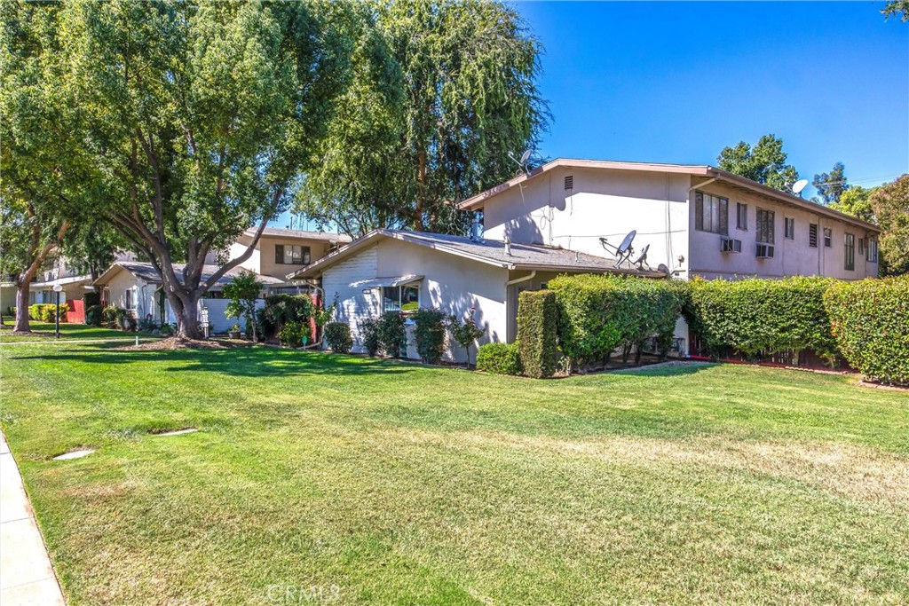 135 North Center Street Redlands, CA 92373 - Photo 35 of 36 a front view of a house with a garden