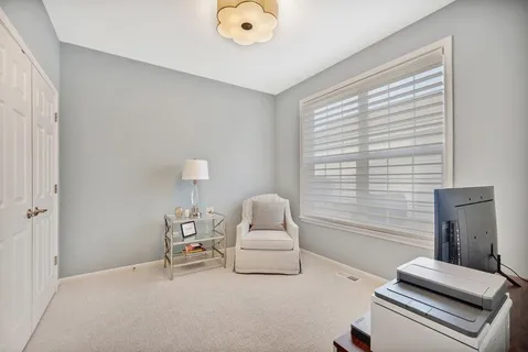 a bedroom with furniture and a window