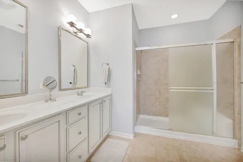 a bathroom with a double vanity sink mirror and double