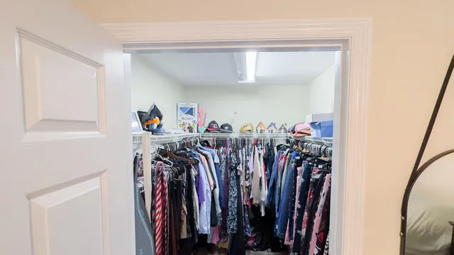a view of a closet with storage